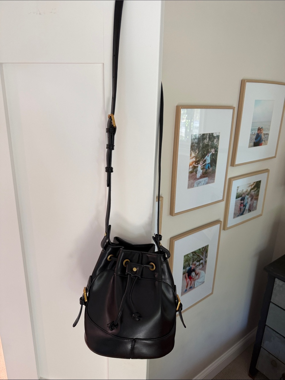 Black Mini Leather Drawstring Bucket Bag with Gold Accents